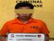 Seorang pria berinisial S alias Ihsan mengenakan baju tahanan oranye saat diamankan di Polres Bengkalis.